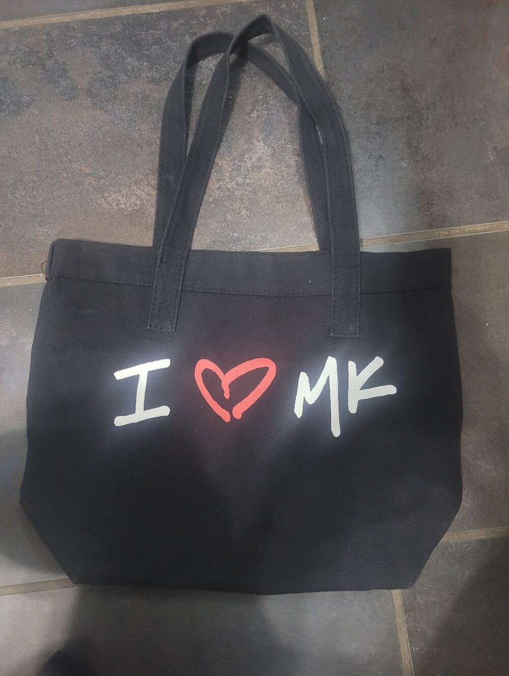 Michael Kors tote bag featuring a prominent white and red "I ♡ MK"